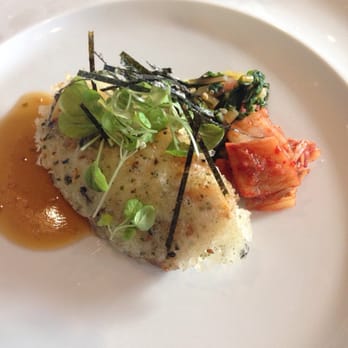 MW Restaurant - Second course- mochi crusted opakapaka paired with sake. - New American Near Me - Honolulu, Hawaii