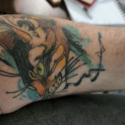 Rock N Roll Tattoo & Piercing - My buddy Odin. This is where he lays his head when sleeping.