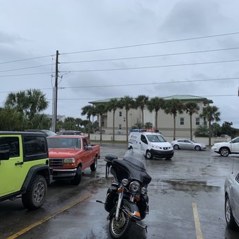 Tom Thumb - a motorcycle parked in a parking lot - Gas Stations Near Me - Santa Rosa Beach, Florida