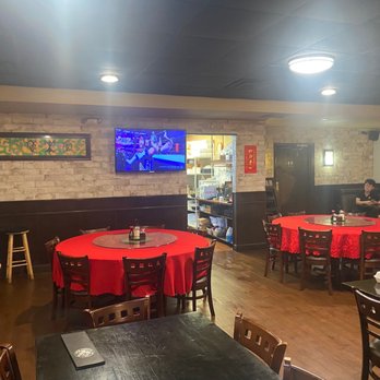 Szechuan Bistro - a man standing in a restaurant - Szechuan Near Me - Oklahoma City, Oklahoma