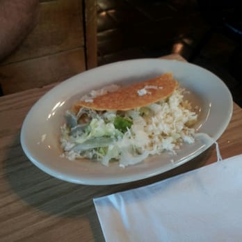 Tequilas - a plate of food on a table - Mexican Near Me - Marion, Illinois Tequilas - a plate of food on a table - Mexican Near Me - Marion, Illinois