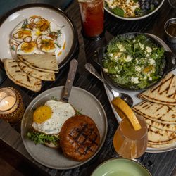 The Semi-Tropic - Breakfast sandwich and other brunch items on a table