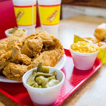 Chicken Express - a tray of fried chicken, macaroni and cheese, and two cups of macaroni and cheese - Chicken Wings Near Me - College Station, Texas