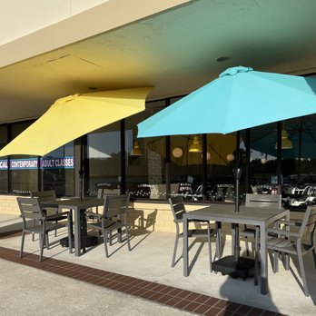 Eggs Up Grill - Tables with umbrellas for shade to eat outdoors. - Breakfast & Brunch Near Me - Apopka, Florida Eggs Up Grill - Tables with umbrellas for shade to eat outdoors. - Breakfast & Brunch Near Me - Apopka, Florida