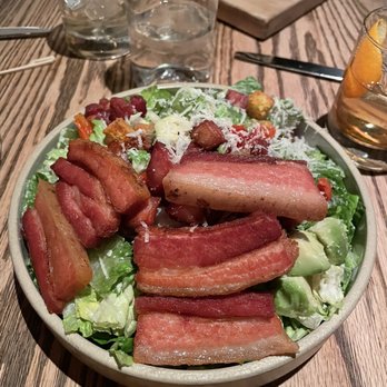 Yardbird - The Caesar Salad with pork belly - Southern Near Me - Las Vegas, Nevada Yardbird - The Caesar Salad with pork belly - Southern Near Me - Las Vegas, Nevada
