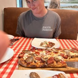 This is their thin crust baked pizza loaded with pepperoni and homemade sausage with a kick! This is their thin crust baked pizza loaded with pepperoni and homemade sausage with a kick!