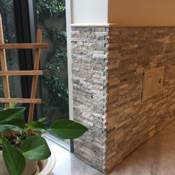 Jcustom Stone - Closeup of stone backsplash - General Contractors Near Me