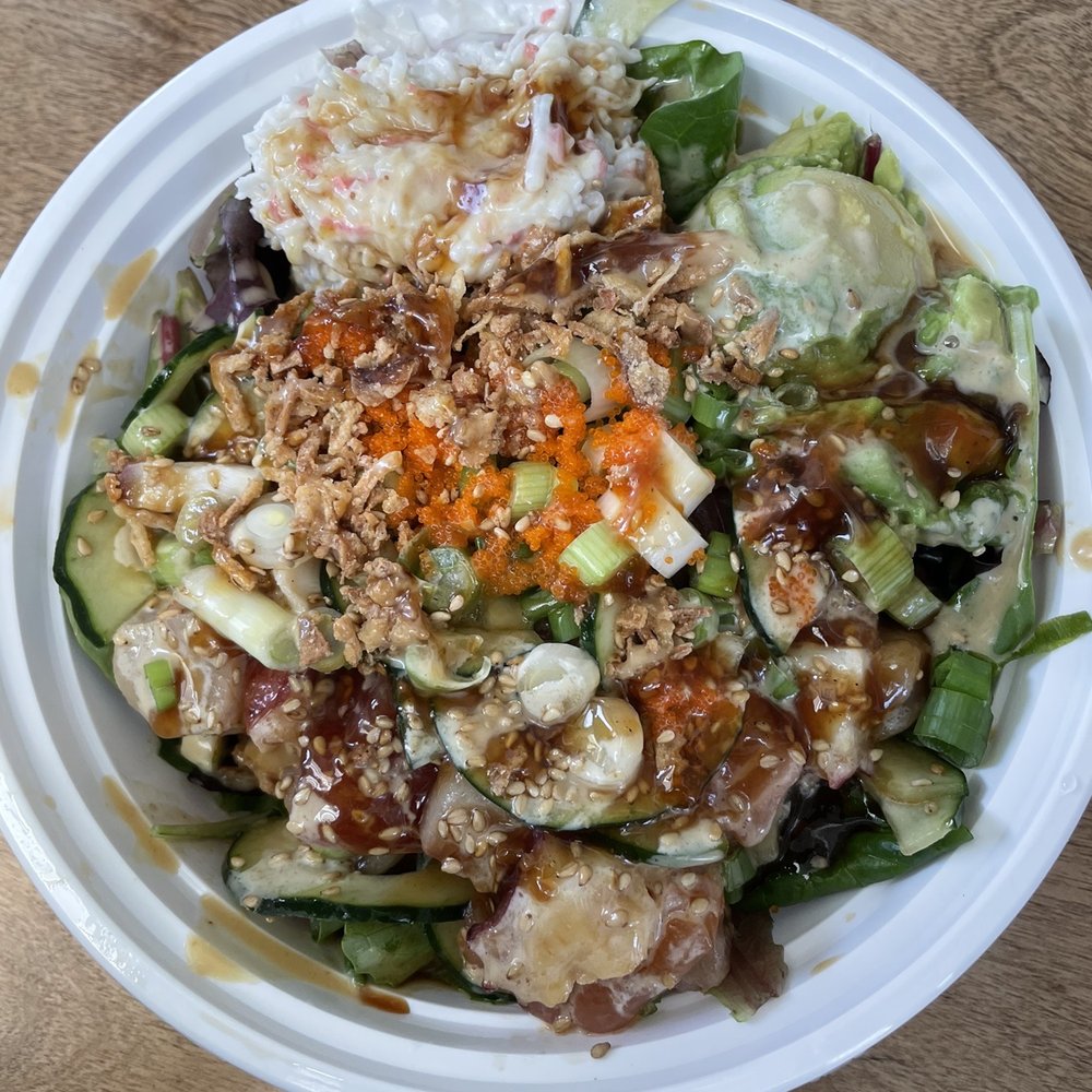 a plate of food with a salad in it a plate of food with a salad in it
