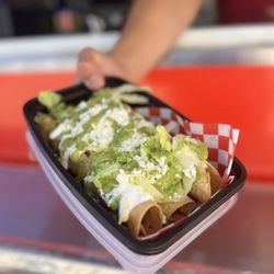 The Big Taquito - Chicken and cheese taquito with green salsa