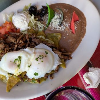 Maria's Restaurant & Cantina - Asada Chilequiles with poached eggs. - Mexican Near Me - Sedona, Arizona Maria's Restaurant & Cantina - Asada Chilequiles with poached eggs. - Mexican Near Me - Sedona, Arizona
