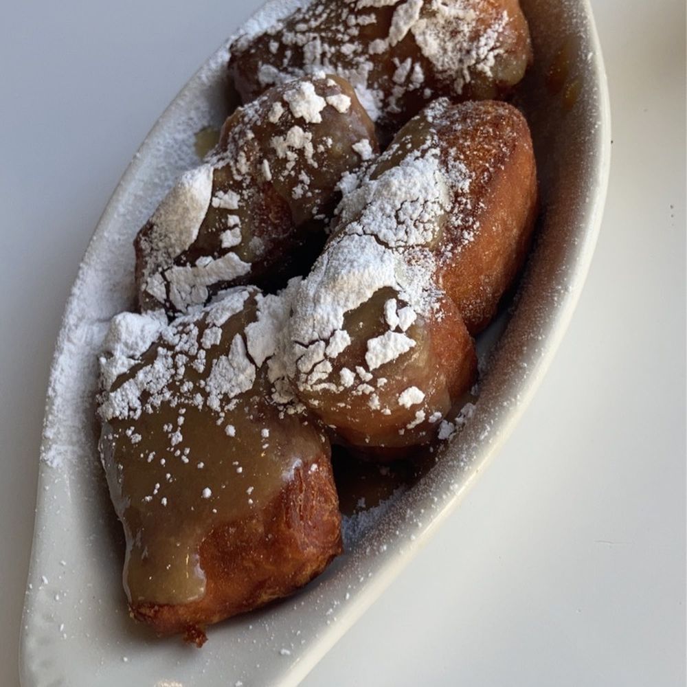 Skillet Junction - a plate of powdered sugared donuts - Breakfast & Brunch Near Me - Jackson, Tennessee Skillet Junction - a plate of powdered sugared donuts - Breakfast & Brunch Near Me - Jackson, Tennessee