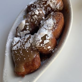 Skillet Junction - a plate of powdered sugared donuts - Breakfast & Brunch Near Me - Jackson, Tennessee
