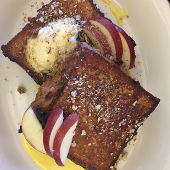 Heritage Tavern - HAZELNUT FRENCH TOAST: vanilla anglaise, Amish maple syrup, market butter, fresh market fruit, pecans ($12) - New American Near Me - Madison, Wisconsin