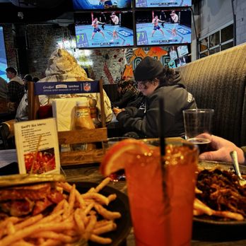 Trainwreck - Booth view of a busy UFC night - Chicken Wings Near Me - Colorado Springs, Colorado Trainwreck - Booth view of a busy UFC night - Chicken Wings Near Me - Colorado Springs, Colorado
