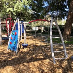 Cedar Park - Toddler play structure. Recommended for ages 2-5 years with adult supervision. 1 slide, climbing wall, balance beam, stepping pods