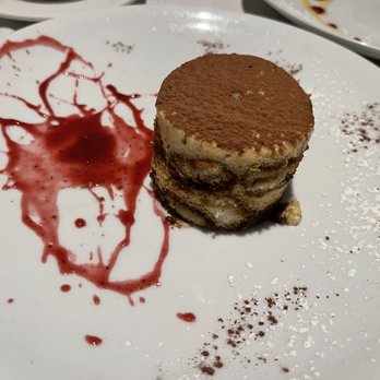 Al Tiramisu - Tiramisu with a raspberry sauce on the side. - Italian Near Me - Washington, DC, District of Columbia
