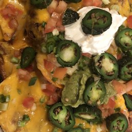 Super nachos with shredded beef and roasted jalapeños Super nachos with shredded beef and roasted jalapeños