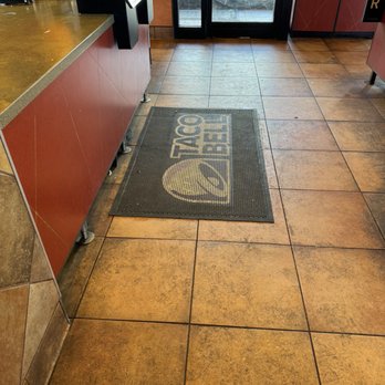 Taco Bell - Filthy floor with black stains everywhere and old gum on it. My shoe was stuck to the floor at one point. - Fast Food Near Me - Franklin, Massachusetts