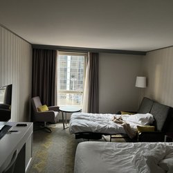 Renaissance Paris La Defense Hotel - Sorry for the messy room. I forgot to take a photo when I checked in. King sized bed and sofa bed for my daughter
