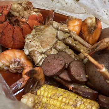 The Crab Cracker - 2 Lobster Tails, Snow Crab Legs, Shrimp with No Head, Potatoes, Corn on the Cobs - Cajun/Creole Near Me - Charlotte, North Carolina The Crab Cracker - 2 Lobster Tails, Snow Crab Legs, Shrimp with No Head, Potatoes, Corn on the Cobs - Cajun/Creole Near Me - Charlotte, North Carolina