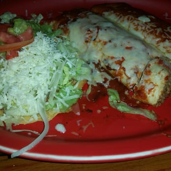 El Rio - a red plate with a chicken entree and a salad - Mexican Near Me - Creedmoor, North Carolina El Rio - a red plate with a chicken entree and a salad - Mexican Near Me - Creedmoor, North Carolina