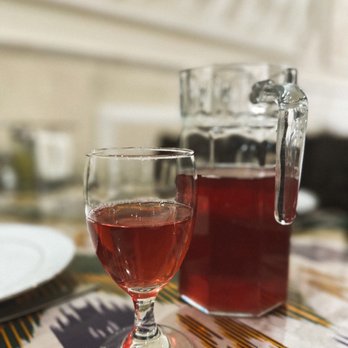 Marakand - a glass of wine and a pitcher on a table - Kebab Near Me - Rego Park, New York Marakand - a glass of wine and a pitcher on a table - Kebab Near Me - Rego Park, New York