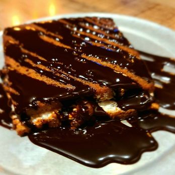 Charred Pie - a piece of cake with chocolate sauce drizzled over it - Pizza Near Me - Oro Valley, Arizona Charred Pie - a piece of cake with chocolate sauce drizzled over it - Pizza Near Me - Oro Valley, Arizona