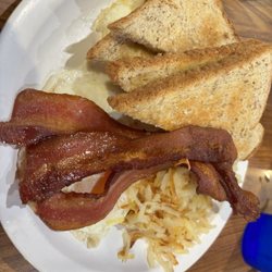 Mama Carol's Kitchen - Eggs with bacon, hash browns, and toast.