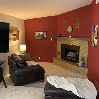 Ernesto Dominguez Painting - The red was is cheap wood wood paneling. - Painters Near Me