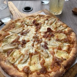 Pear and Brie pizza (olive oil, buffalo mozzarella, baked pears, Brie cheese, bacon, chile honey) Pear and Brie pizza (olive oil, buffalo mozzarella, baked pears, Brie cheese, bacon, chile honey)