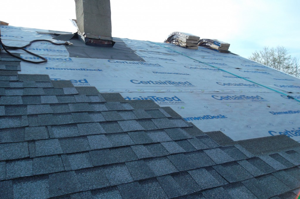 Slide of Migos Roofing