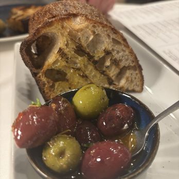 Naōs Hellenic Cuisine - Sourdough bread with olives (bread was too hard) but still delicious - Wine Bars Near Me - Cary, North Carolina Naōs Hellenic Cuisine - Sourdough bread with olives (bread was too hard) but still delicious - Wine Bars Near Me - Cary, North Carolina