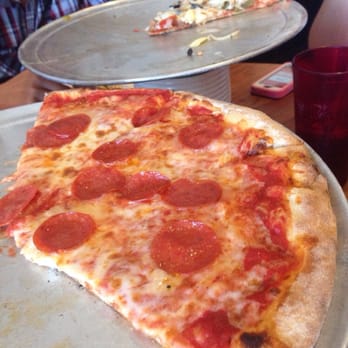 Spuntino Pizzeria - What's left of our 2 large pizzas (pepperoni and pizza tutto). Love the crust - Italian Near Me - Temecula, California