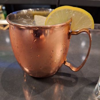 Copper Boar American Pub - a drink in a copper mug with a lemon wedge - Cocktail Bars Near Me - North Liberty, Iowa