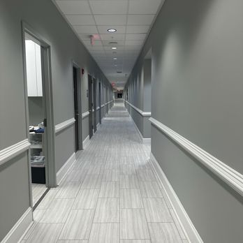 Mount Pleasant Dermatology - Long hallway in dermatology clinic lined with exam rooms - Dermatologists Near Me - Mount Pleasant, South Carolina Mount Pleasant Dermatology - Long hallway in dermatology clinic lined with exam rooms - Dermatologists Near Me - Mount Pleasant, South Carolina