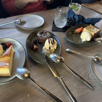 Junior Restaurant - From left to right: brûlée vanilla cheesecake, molten chocolate lava cake, and banana pecan bread pudding - Lounges Near Me - Roseville, California Junior Restaurant - From left to right: brûlée vanilla cheesecake, molten chocolate lava cake, and banana pecan bread pudding - Lounges Near Me - Roseville, California
