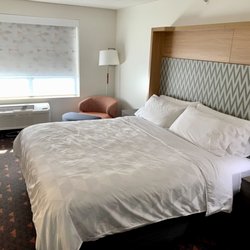 Holiday Inn & Suites - Bothell - Modern and contemporary design, comfortable room with lots of USB outlets to charge devices too.