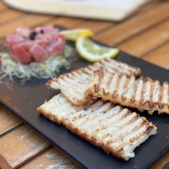 Via Toscana - a plate of food on a table - Tapas Bars Near Me - New York, New York Via Toscana - a plate of food on a table - Tapas Bars Near Me - New York, New York