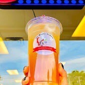Shakes Anderson - a hand holding a cup of orange juice - Desserts Near Me - Anderson, Indiana