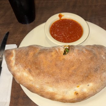 Romano's Pizza - Fantastic Calzone stuffed with cheese, chicken, mushrooms & peppers !!! - Pizza Near Me - Houston, Texas
