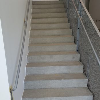 Diamond Techniques - a set of stairs in a building - Flooring Near Me - Cedar Rapids, Iowa Diamond Techniques - a set of stairs in a building - Flooring Near Me - Cedar Rapids, Iowa