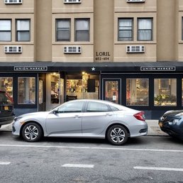 two cars parked in front of a building