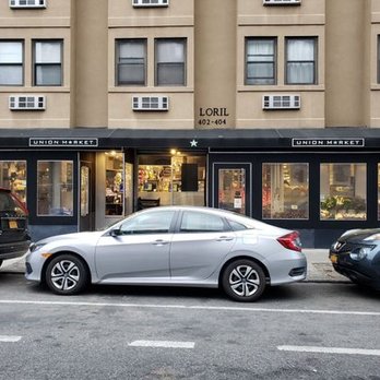Union Market - two cars parked in front of a building - Grocery Near Me - Brooklyn, New York