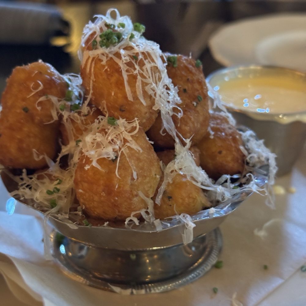 Goodwin’s - Pillowy soft, cheesy, chive, herbaceous and dripping in deliciousness beignets. They're so fluffy you'll want to die. - Cocktail Bars Near Me - Dallas, Texas Goodwin’s - Pillowy soft, cheesy, chive, herbaceous and dripping in deliciousness beignets. They're so fluffy you'll want to die. - Cocktail Bars Near Me - Dallas, Texas