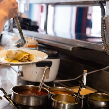 Pacífico - a chef preparing food in a commercial kitchen - Latin American Near Me - New Haven, Connecticut Pacífico - a chef preparing food in a commercial kitchen - Latin American Near Me - New Haven, Connecticut