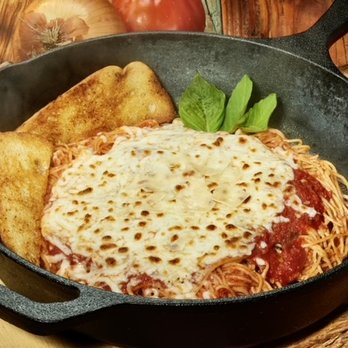 Uncle Chicken's Cast Iron Kitchen - a skillet of spaghetti and bread - Comfort Food Near Me - New Smyrna Beach, Florida Uncle Chicken's Cast Iron Kitchen - a skillet of spaghetti and bread - Comfort Food Near Me - New Smyrna Beach, Florida