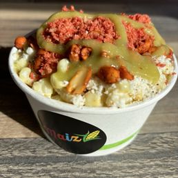 Mexican corn with crushed takis and spicy peanuts Mexican corn with crushed takis and spicy peanuts