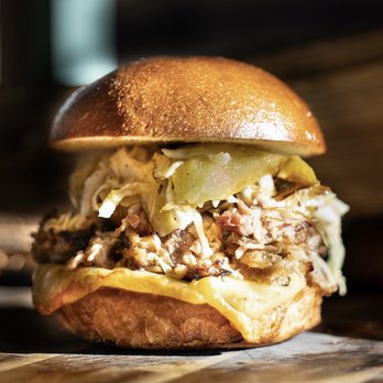 The Bone Shop - Smoked apple & pork burger with Gouda cheese and mayo free slaw. - Food Delivery Services Near Me The Bone Shop - Smoked apple & pork burger with Gouda cheese and mayo free slaw. - Food Delivery Services Near Me