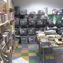 Wee Care Burlington - Inside Wee Care Burlington: books, bins with clothes, toys