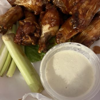 Park Street - BBQ Chicken Wings with Celery Sticks and Blue Cheese Dressing - New American Near Me - Mundelein, Illinois Park Street - BBQ Chicken Wings with Celery Sticks and Blue Cheese Dressing - New American Near Me - Mundelein, Illinois